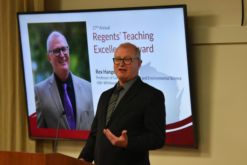 Photo of UW-Whitewater Professor Rex Hanger making acceptance remarks after receiving the 2019 Teaching Excellence Award from the UW System Board of Regents on April 5, 2019.
