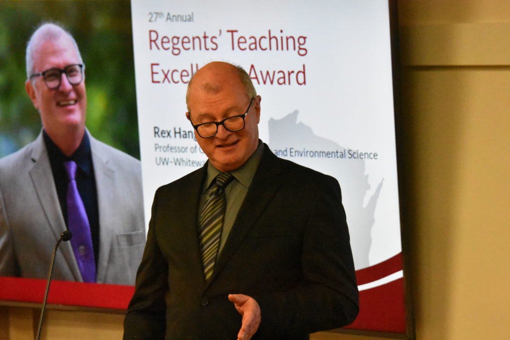 Photo of UW-Whitewater Professor Rex Hanger making acceptance remarks after receiving the 2019 Teaching Excellence Award from the UW System Board of Regents on April 5, 2019.