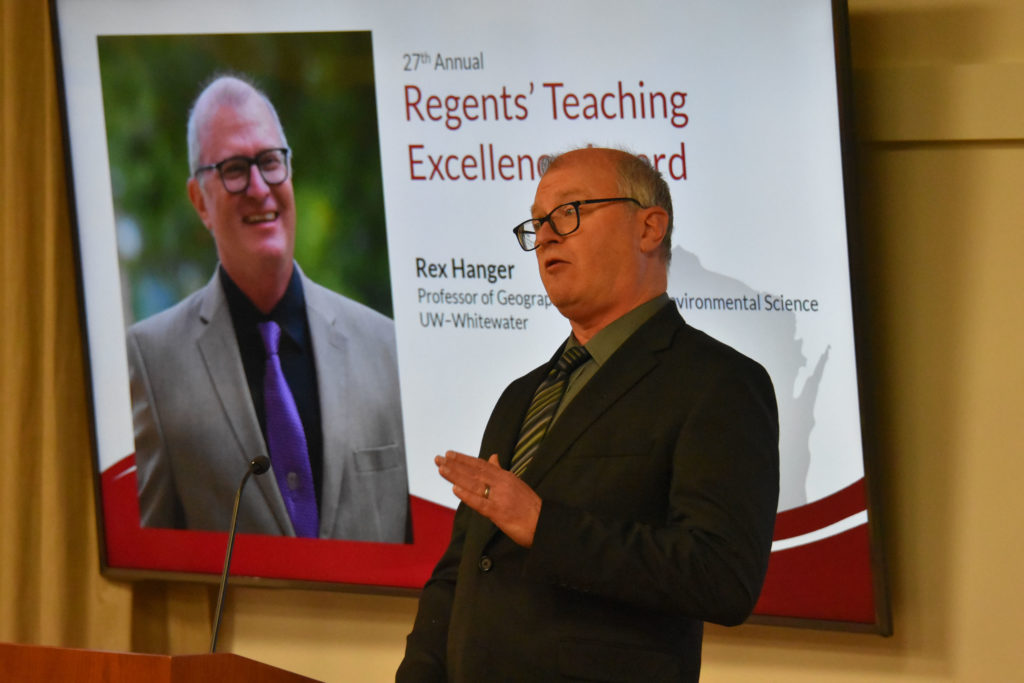 Photo of UW-Whitewater Professor Rex Hanger making acceptance remarks after receiving the 2019 Teaching Excellence Award from the UW System Board of Regents on April 5, 2019.