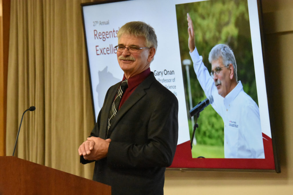 Photo of Gary Onan, Chair and Professor of Animal and Food Science at UW-River Falls, making acceptance remarks after receiving the 2019 Teaching Excellence Award from the UW System Board of Regents on April 5, 2019.