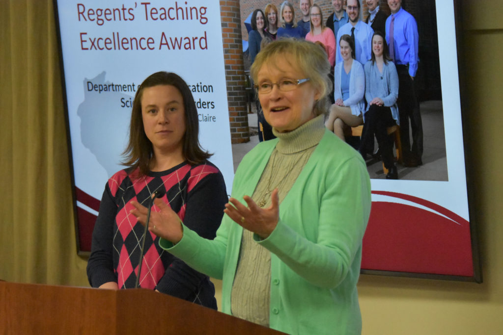 Photo of Department chair Dr. Vicki Samelson making acceptance remarks on behalf of UW-Eau Claire's Department of Communication Sciences and Disorders, which received a UW System Board of Regents 2019 Teaching Excellence Award on April 5, 2019. Also pictured: Associate Professor Abby Hemmerich.