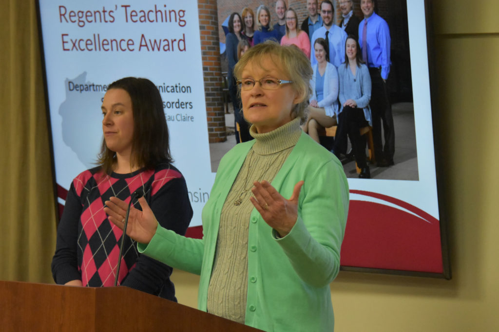 Photo of Department chair Dr. Vicki Samelson making acceptance remarks on behalf of UW-Eau Claire's Department of Communication Sciences and Disorders, which received a UW System Board of Regents 2019 Teaching Excellence Award on April 5, 2019. Also pictured: Associate Professor Abby Hemmerich.