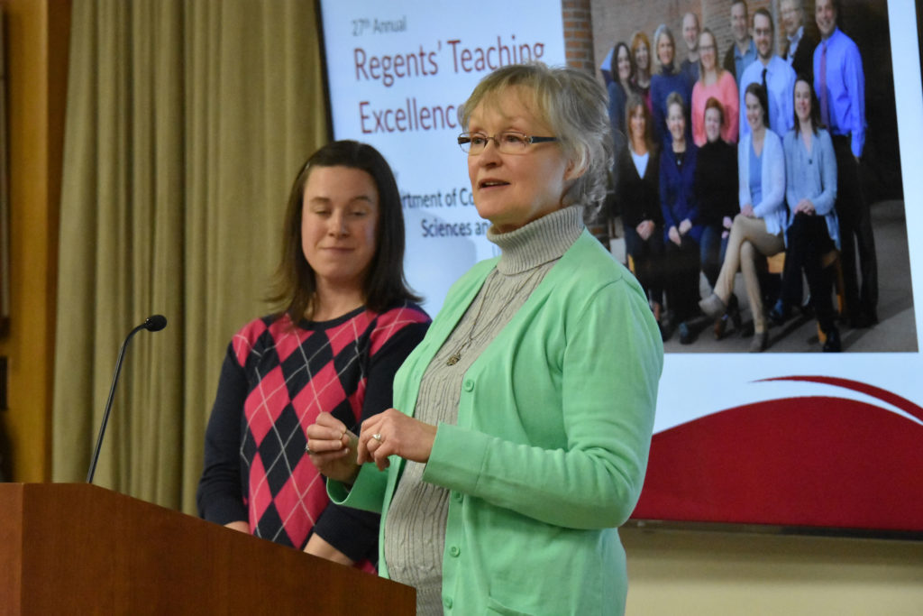 Photo of Department chair Dr. Vicki Samelson making acceptance remarks on behalf of UW-Eau Claire's Department of Communication Sciences and Disorders, which received a UW System Board of Regents 2019 Teaching Excellence Award on April 5, 2019. Also pictured: Associate Professor Abby Hemmerich.
