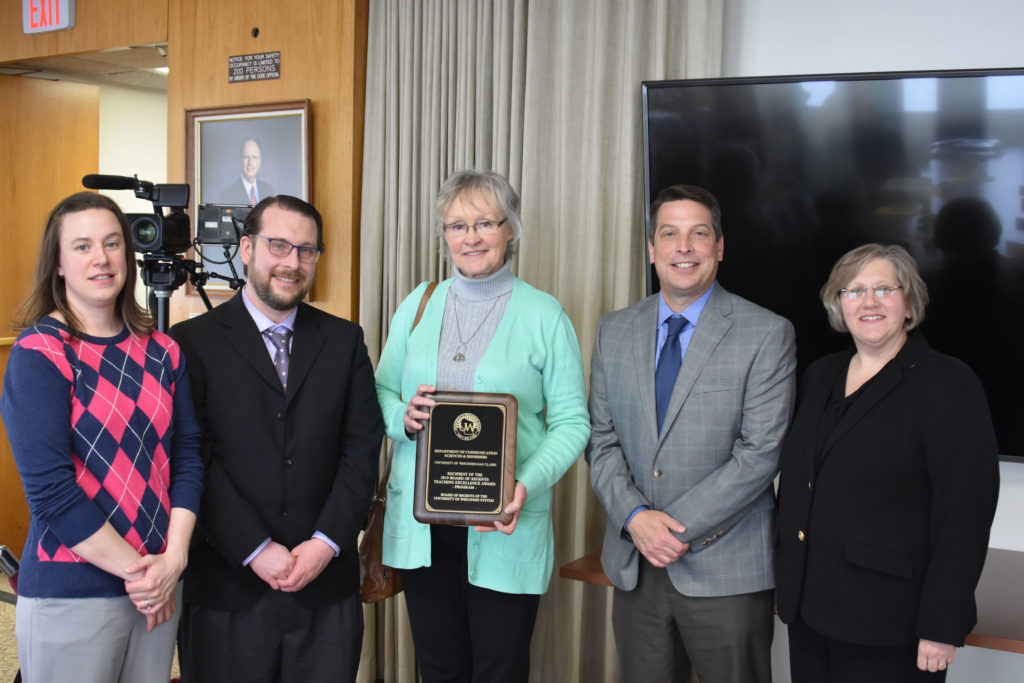 Photo of members of the UW-Eau Claire Department of Communication Sciences and Disorders receiving a UW System Board of Regents 2019 Teaching Excellence Award at the Board of Regents meeting held in Madison on April 5, 2019. Pictured from left: Associate Professor Abby Hemmerich, Assistant Professor Thomas Kovacs, Department Chair Vicki Samelson, Assistant Professor Tom Sather, and Carmen Manning, dean of UW-Eau Claire’s College of Education and Human Sciences.