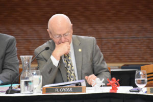 Photo of President Ray Cross with lion figurines, a gift from the Hessen delegation