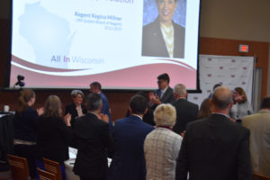 Photo of Regent Emerita Regina Millner greeting Regents