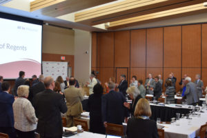 Photo of Regent Emeritus S. Mark Tyler greeting Regents