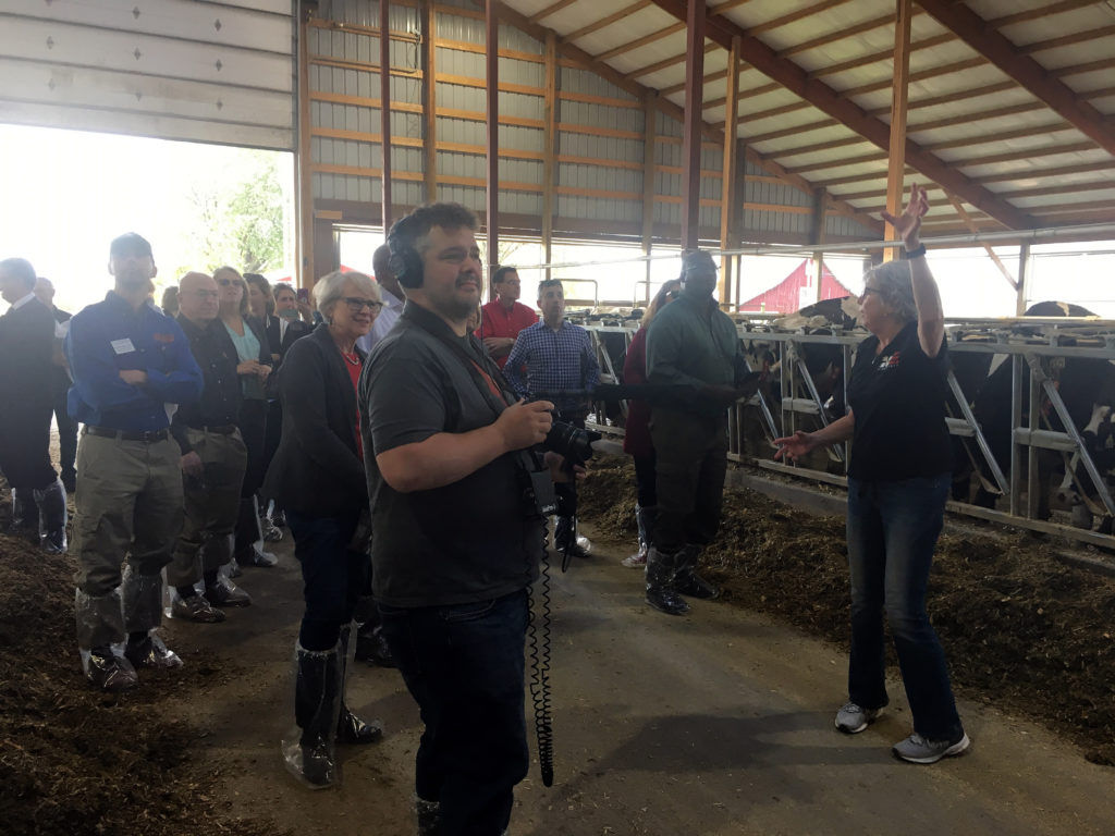 Photo of Wayne Weber, Dean of the College of Business, Industry, Life Science and Agriculture at UW-Platteville (left), and Kate VandenBosch, Dean of the College of Agricultural and Life Sciences at UW-Madison (middle), touring Four Cubs Farm with Regent Cris Peterson (right).