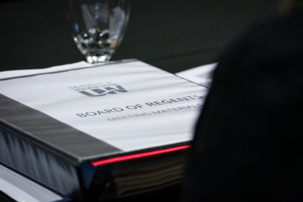 Photo of binder of materials at the Board of Regents meeting hosted by UW-Superior on October 10-11, 2019.