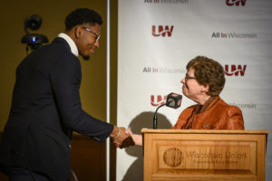 Photo of Kevin Crosby shaking hands with Chancellor Rebecca Blank