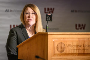 Photo of Angela Ruppe, Director of Student Support Services, accepting the Diversity Award on behalf of UW-Stout's Fostering Success program