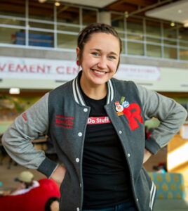 Photo of Elise Peters, UW-River Falls’ Events and Activities Coordinator and We Are Falcons Committee Chair, accepting award on program’s behalf