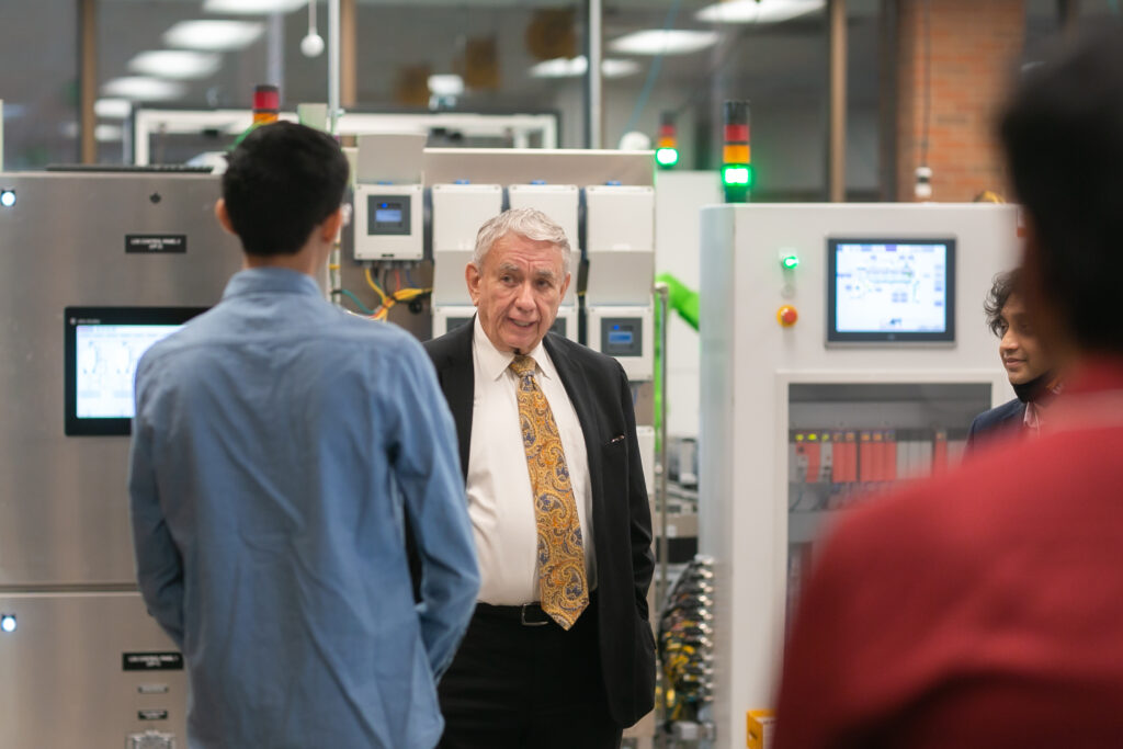 Photo of UW System President Tommy Thompson during tour of UW-Milwaukee's Connected Systems Institute (CSI)