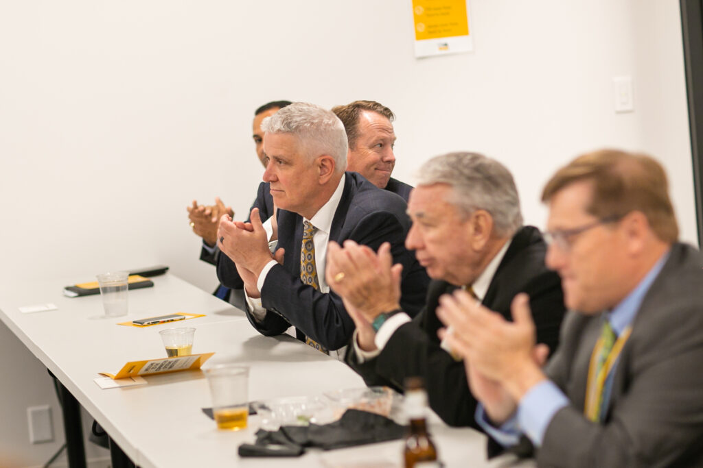 Photo of Regent Robert Atwell (left) and President Tommy Thompson during CSI reception; Regent Vice President Michael M. Grebe in background