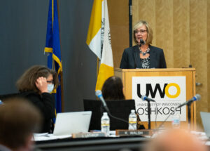 Photo of Monika Pynaker, UW-Green Bay, accepting University Staff Excellence Award