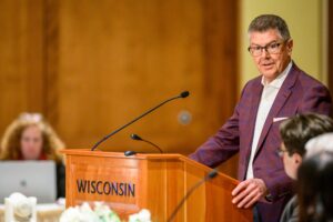 Photo of Regent Emeritus Drew Petersen accepting a resolution of appreciation for his years of service as a Regent, including serving as Regent President and Vice President (Photo by Althea Dotzour / UW–Madison)
