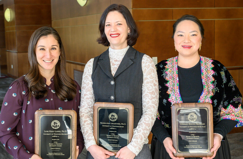 Photo of recipients of the Board of Regents 2023 Diversity Awards posing with their plaques at Union South at the University of Wisconsin–Madison on Feb. 10, 2023. From left, Lori Kido Lopez, UW-Madison; Rickie-Ann Legleitner, UW-Stout; and the UW-River Falls Upward Bound program, award accepted on the program's behalf by Director Bee Vang. (Photo by Althea Dotzour / UW–Madison)