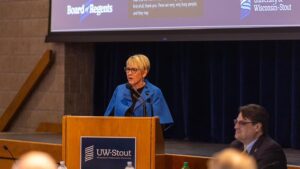 Photo of UW-Stout Chancellor Katherine Frank addressing the Board of Regents in UW-Stout’s Memorial Student Center. / UW-Stout