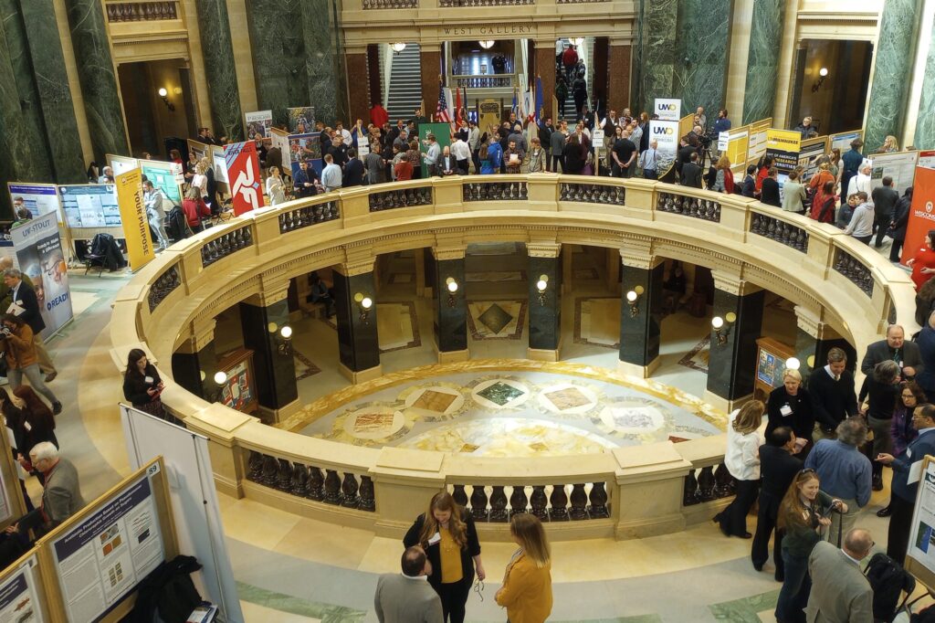 Photo of more than 100 undergraduate students from across the University of Wisconsin System, along with their faculty advisers, showcased research projects at the 19th annual Research in the Rotunda event held in the Wisconsin State Capitol in Madison on March 8, 2023. (Photo credit: UW System)
