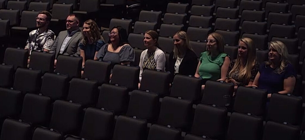 Photo of UWGB Early College Programs staff observing June 9, 2023, awards ceremony