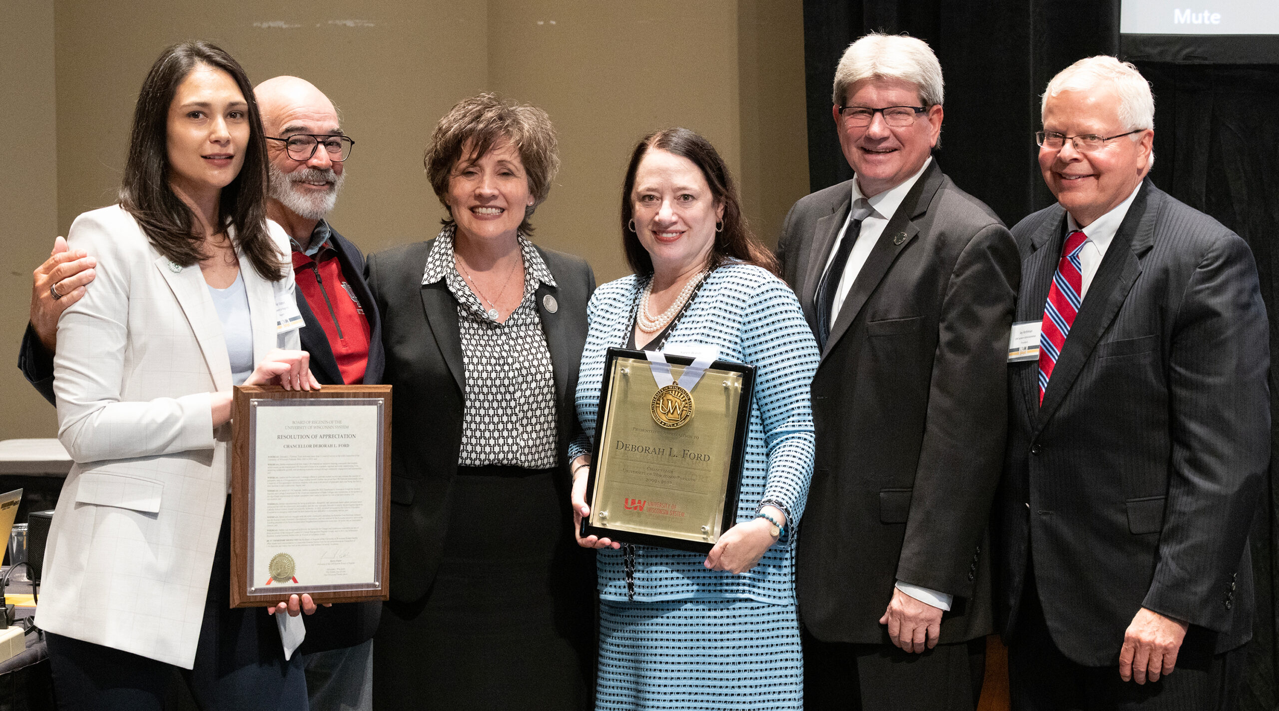 Photo of UW-Parkside Chancellor Debbie Ford (center left) accepting her resolution of appreciation. Also pictured (from left): Regent Jennifer Staton, Regent Emeritus Mike Falbo, Regent President Karen Walsh, Regent Jim Kreuser, and UW System President Jay Rothman