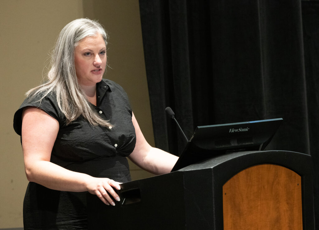 Photo of Meagan Strehlow accepting the Board of Regents 2023 Academic Staff Excellence Award on behalf of UW-Green Bay's Early College Programs (Photo by UWM)