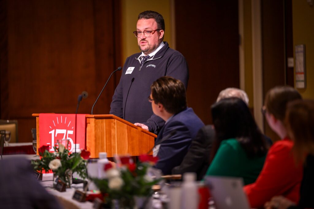 Wes Enterline, UW–Whitewater’s sustainability director, accepts a Regents’ Diversity Award on behalf of the university's Campus Garden Program during the UW Board of Regents meeting hosted at Union South at the University of Wisconsin–Madison on Feb. 9, 2024. (Photo by Althea Dotzour / UW–Madison)