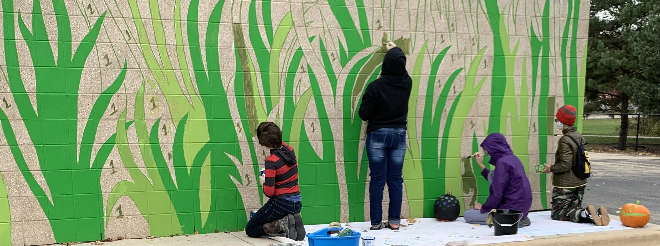 Children painting a mural.