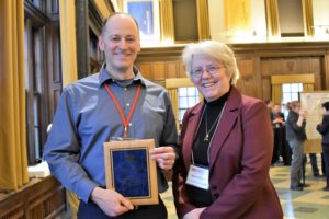 David Voelker, UWGB & Karen Schmitt AVP presenting service plaque