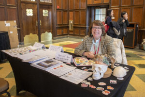 Photo of Joan Shapiro Beigh at a table