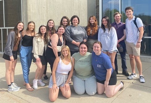 Photo with students outside Winther Hall 2023