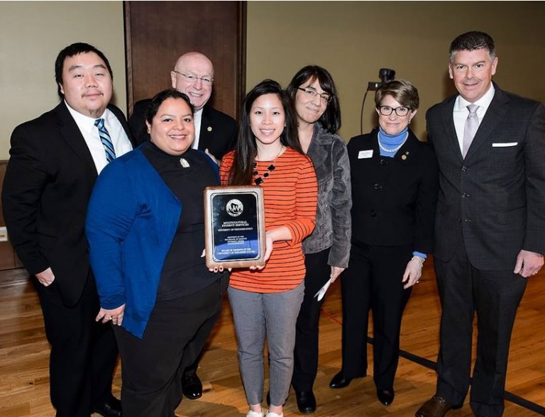 Members of UW-Stout’s Multicultural Student Services accompanied by President Ray Cross, Regent President Regina Millner, and Regent Drew Petersen