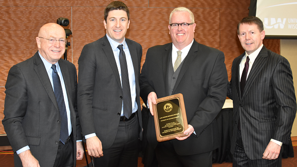 Photo of (from left) Pres. Ray Cross, Regent Bryan Steil, LSRI Director Matthew TenEyck, and Regent Pres. John Robert Behling