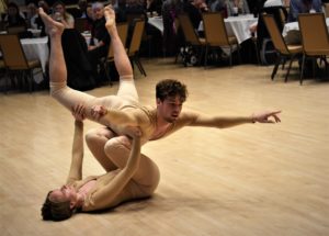 floor pose: man dancer balances on woman