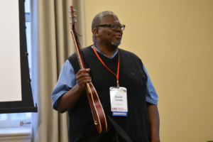 presenter with a guitar