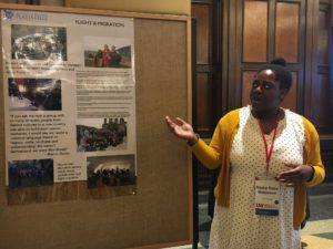 UW-Platteville student with their poster