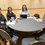 4 UW-Superior colleagues seated at a round table at the UW System Navigate and Advising Workshop March 9, 2023, at UW-Stevens Point