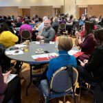 UW System Navigate and Advising Workshop March 9, 2023, at UW-Stevens Point, people seated at tables