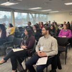 Participants seated in a breakout session at UW System Navigate and Advising Workshop March 2023 at UW-Stevens Point
