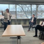 Amy McGovern of UW-Stout gesturing toward her PPT in a breakout session at UW System Navigate and Advising Workshop March 2023 at UW-Stevens Point