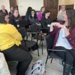 Seated participants in Q&A time at a breakout session at UW System Navigate and Advising Workshop March 2023 at UW-Stevens Point