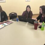 3 women working at their computers in the Mastering Messaging workshop session in a breakout session at UW System Navigate and Advising Workshop March 2023 at UW-Stevens Point