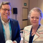Chase Vogel of EAB and Sue Buth of UW System Administration at a breakfast for Wisconsin colleagues at the CONNECTED22 conference began in November 2022 in Orlando, Fla.