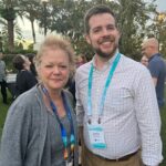 Sue Buth of UW System Administration and Justin Bruchey at the CONNECTED22 conference in November 2022 in Orlando, Fla.