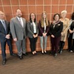 Navigate overview presenters posed before their presentation and discussion on EAB's Navigate student success management platform at the December 8, 2023, Board of Regents meeting on the University of Wisconsin-Madison campus.