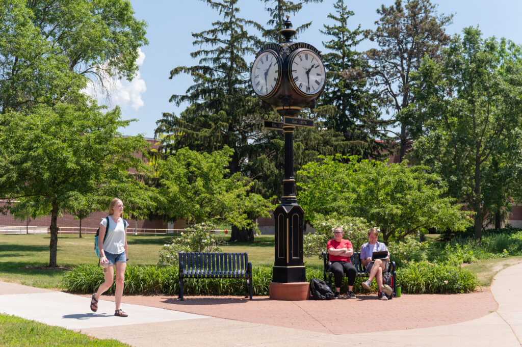 Photo of student walking on UW-River Falls campus