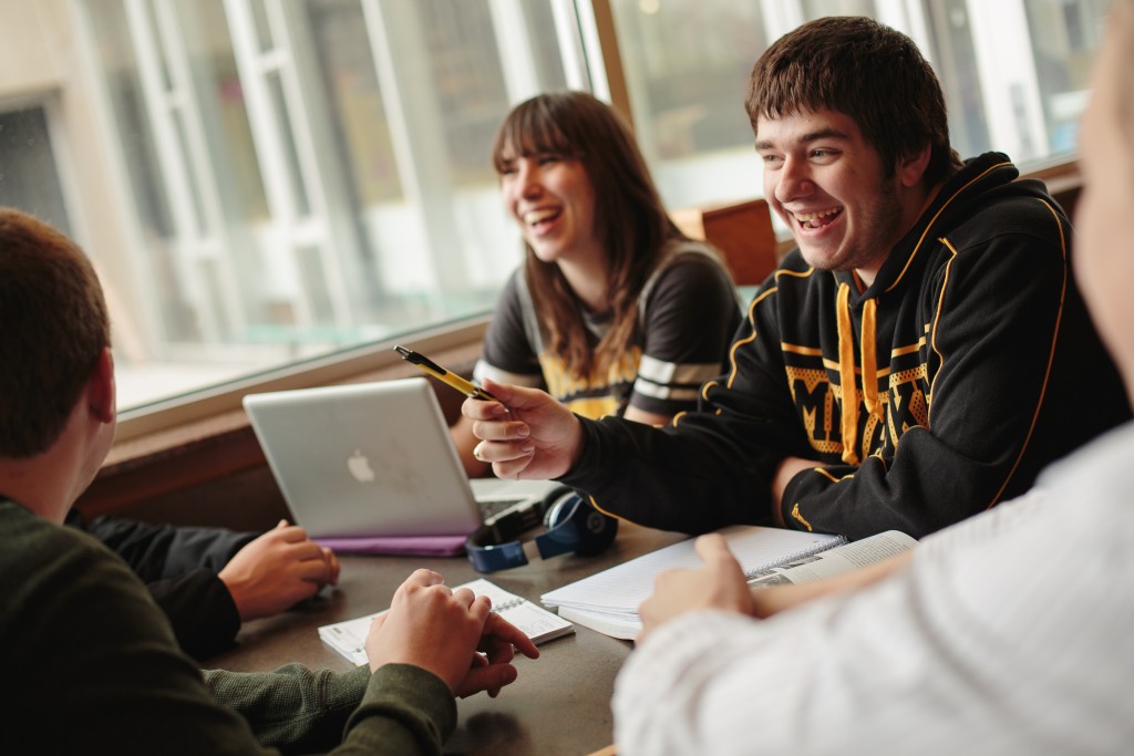Group of students studying with laptop