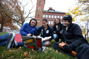 Students studying on the lawn