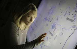 woman reading a back lit state map