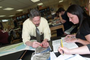 Professor working with student